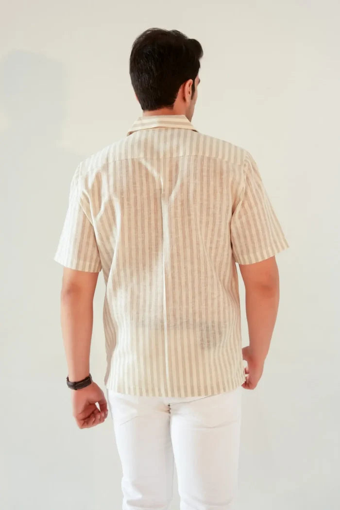 Back view of beige striped linen blend oversized shirt for men with white pants