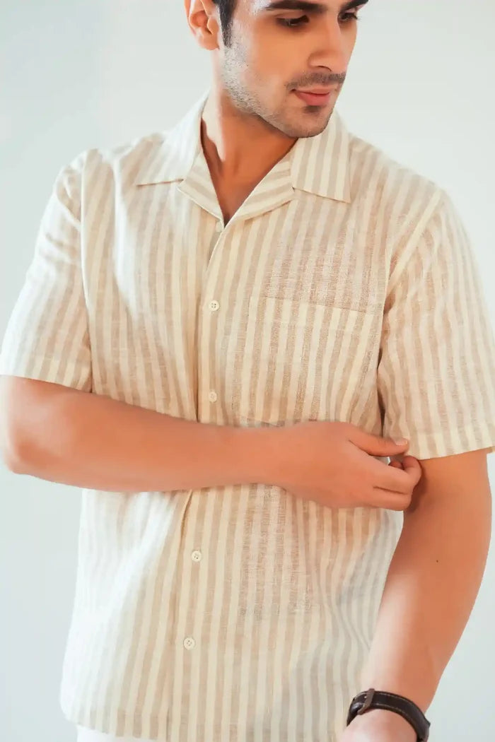 Close-up of camp collar and sleeve detail on beige cotton-linen striped shirt for men