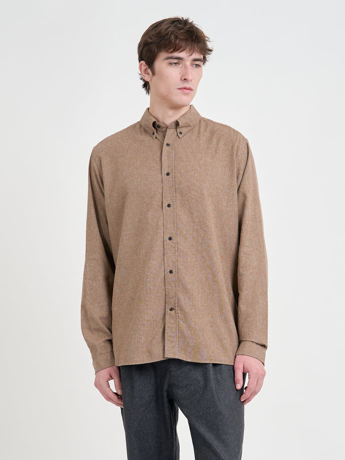 Close up shot of model wearing Oliver Spencer Men's Sand Organic Cotton Shirt