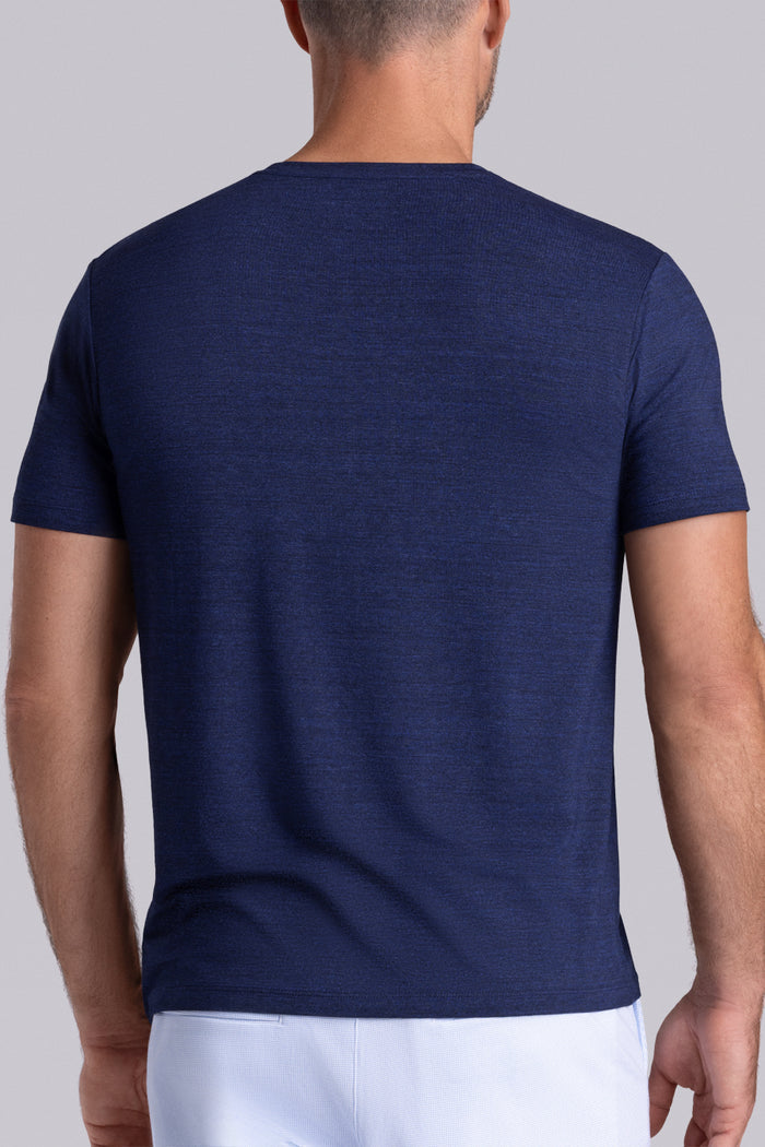 Model wearing the Fundamental Navy Heather Icy Bamboo® short sleeve crewneck, styled with white shorts.