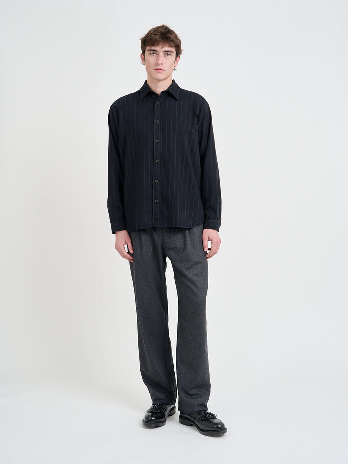 Model is wearing an Oliver Spencer Men's Navy Loose-Fit Organic Cotton Overshirt