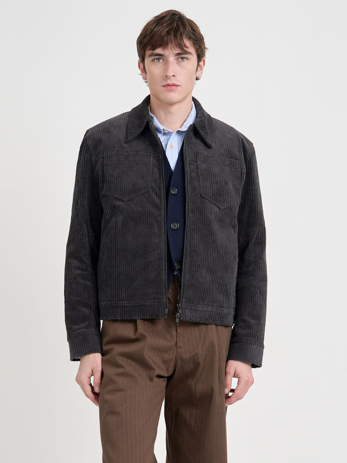 Close up shot of model wearing Oliver Spencer Men's Grey Cotton Corduroy Trucker Jacket
