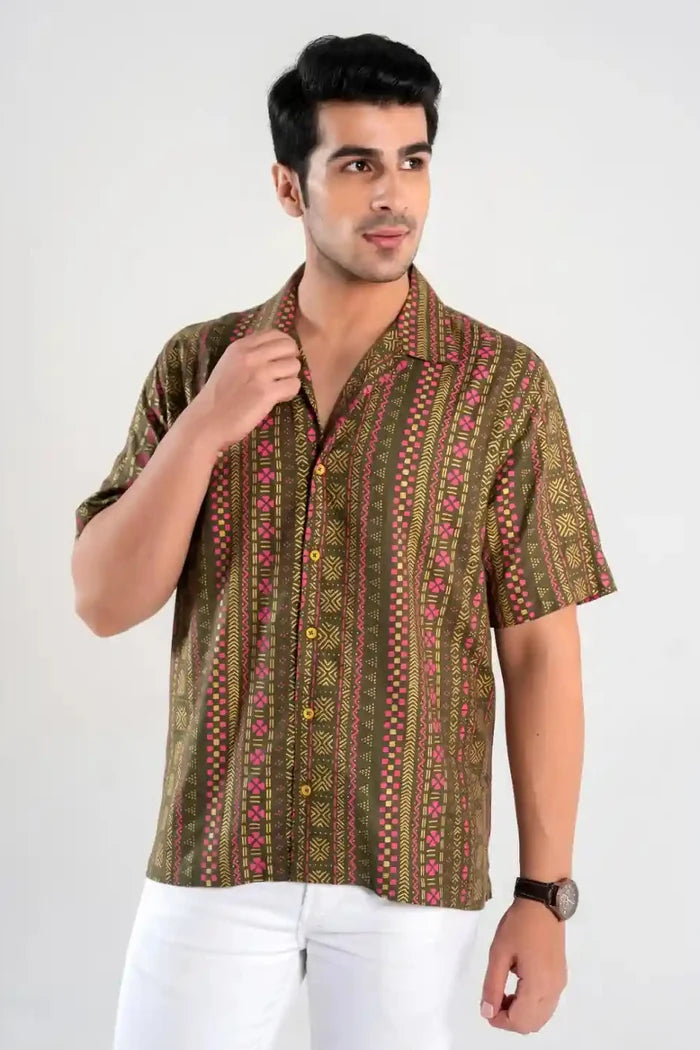 Front view of men’s olive green short sleeve shirt with geometric print and camp collar