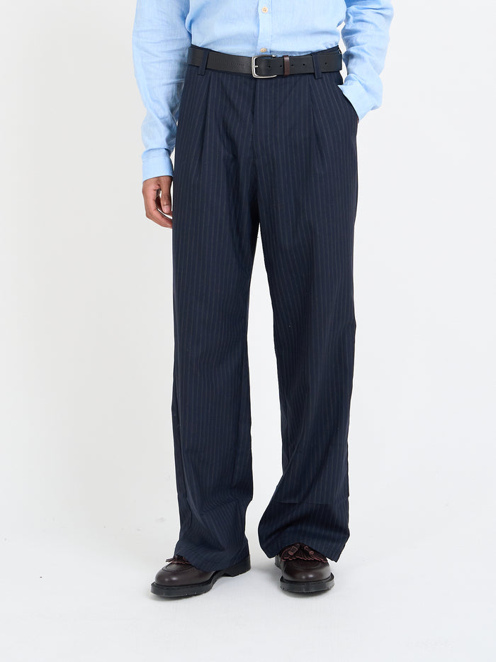 Orsman navy pinstripe wool trousers showing rear welt and patch pocket detail