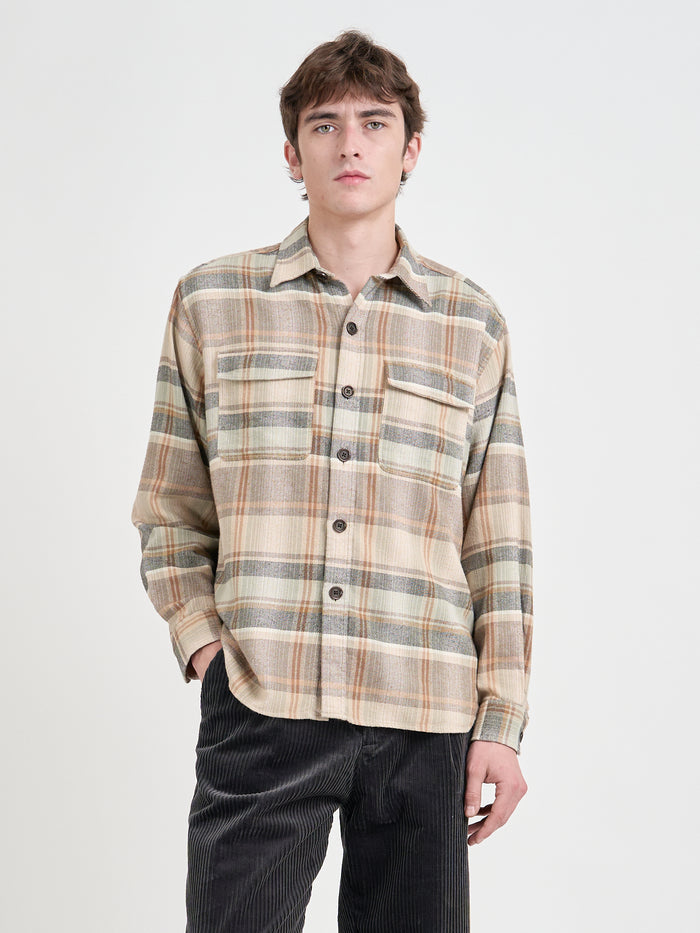 Close up shot of model wearing an Oliver Spencer Men's Beige Brushed Cotton Check Overshirt