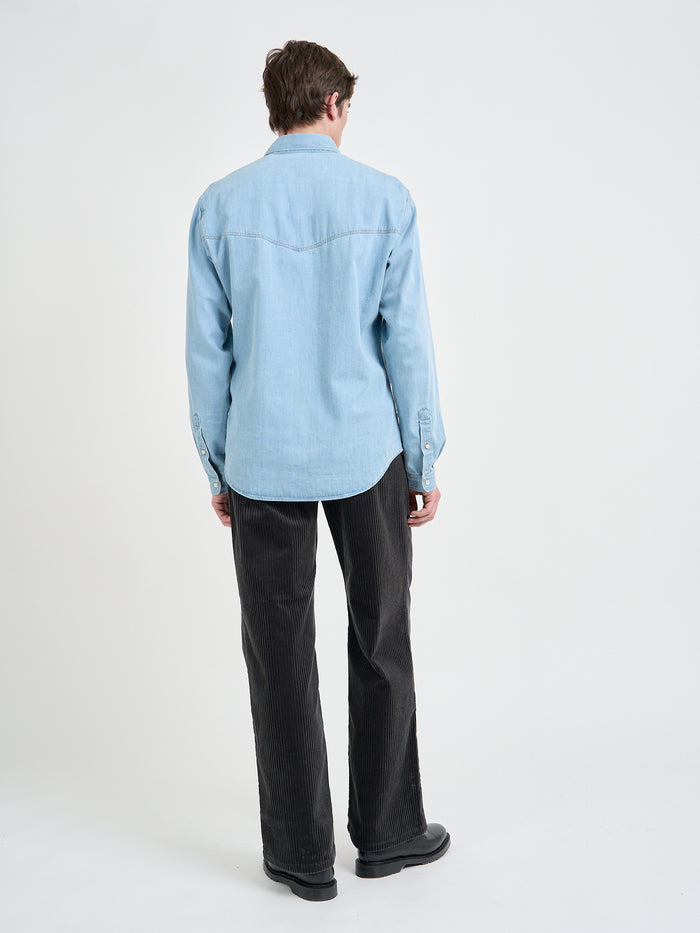 Model is wearing an Oliver Spencer Light Indigo Denim Western Shirt