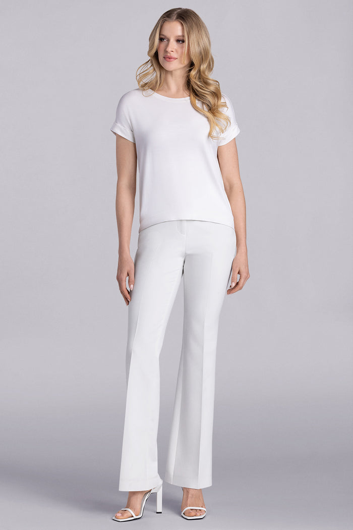 Model wearing Savanna Whisper White Icy Bamboo® crew neck short sleeve t-shirt, styled with white pants.