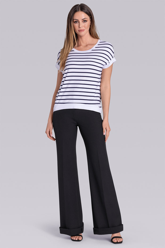 Model wearing Savanna White Deep Sea Blue Icy Bamboo® crew neck short sleeve t-shirt, styled with black pants.
