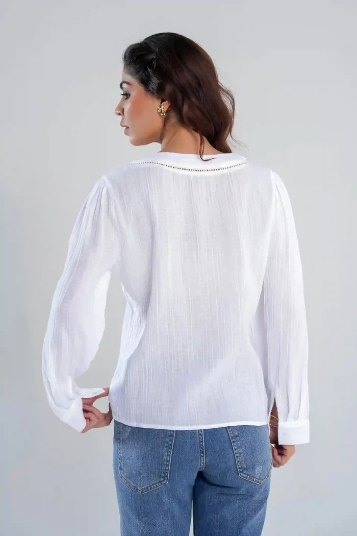 Back view of women’s white textured cotton shirt with long sleeves