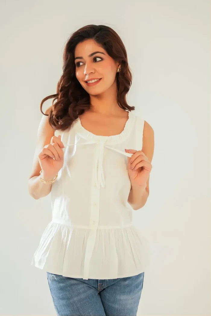 Model styling white sleeveless cotton cottagecore peplum top with frill detailing and hip-length silhouette – Drape Panda outfit