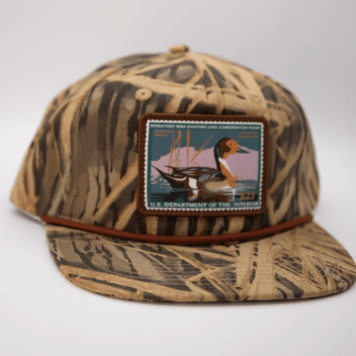Woodley Co Duck Stamp Hat Northern Pintail 24’-25’ Woodley Co Mossy Oak Shadowgrass Rope Headwear Rivers and Glen Trading Co